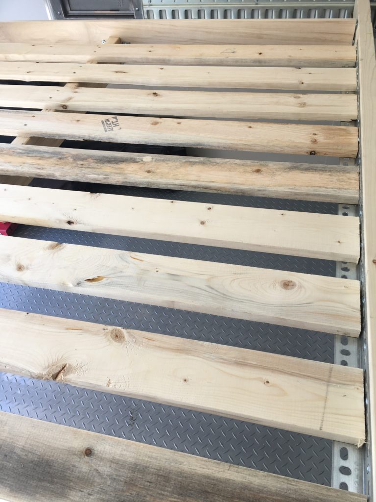 The wooden slats that form the bed frame