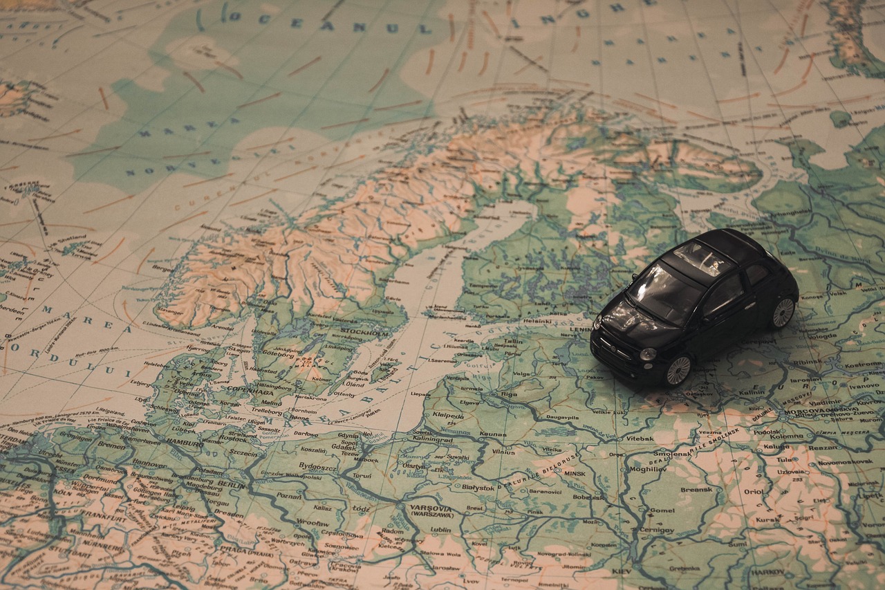 Picture of a map with a toy car on it.