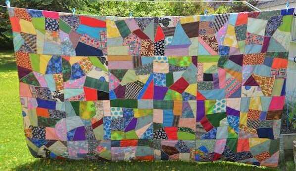 Crazy quilt made by 88-year-old seamstress using family fabric scraps